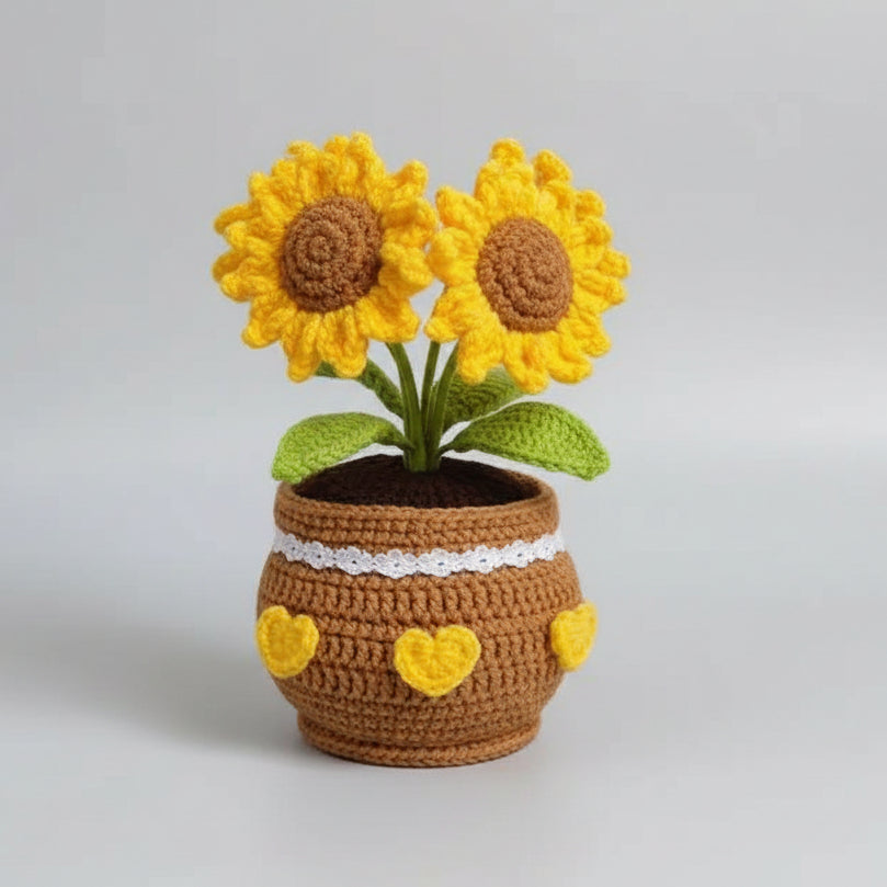 Crocheted potted sunflower plant with two yellow blooms, brown heart pot, green leaves