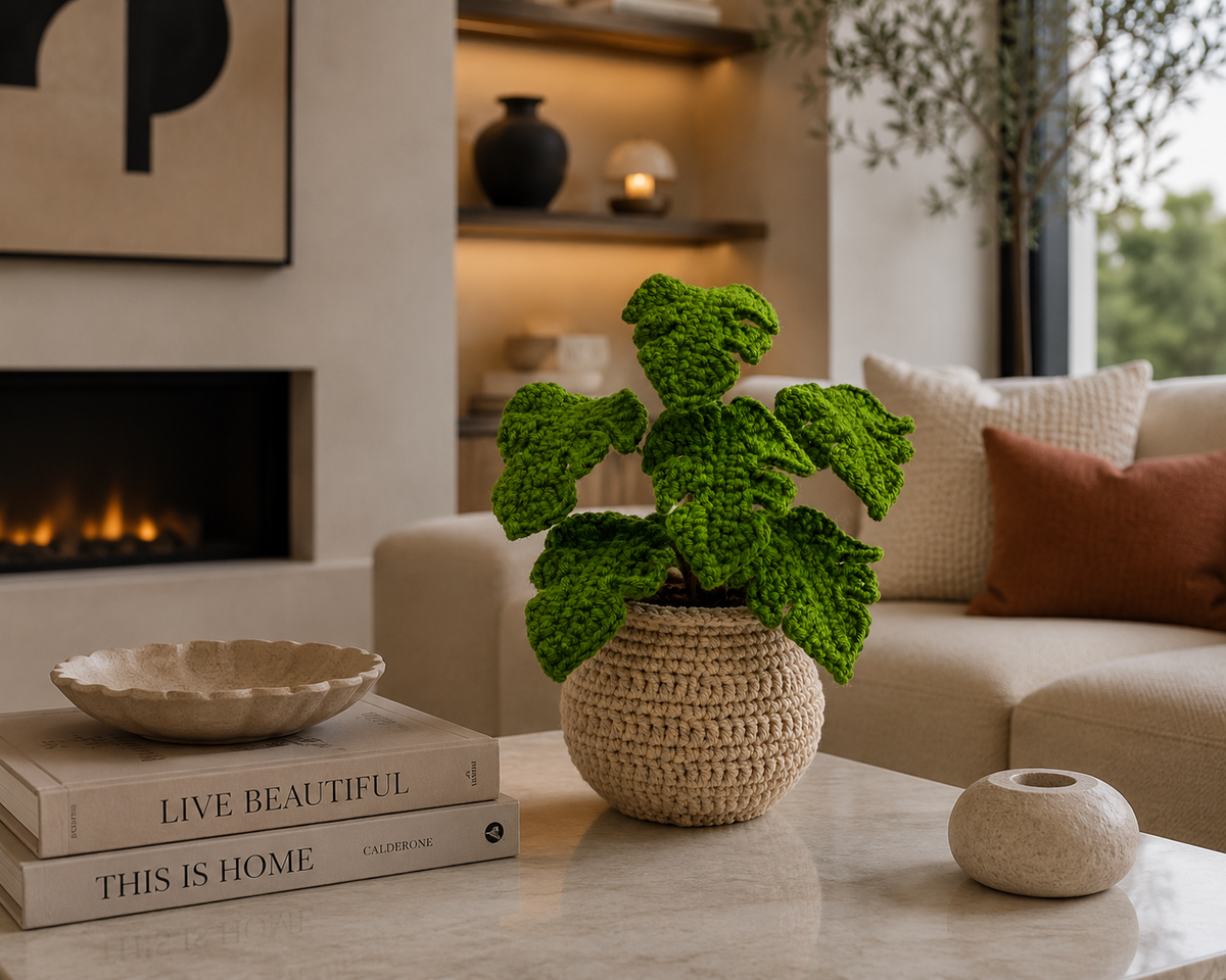 Crochet monstera plant in tan knitted pot with textured bright green leaves