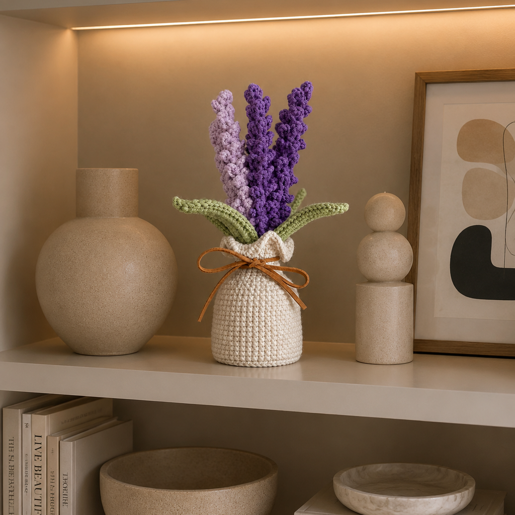 Handmade crocheted lavender plant in cream pot with green leaves on shelf display