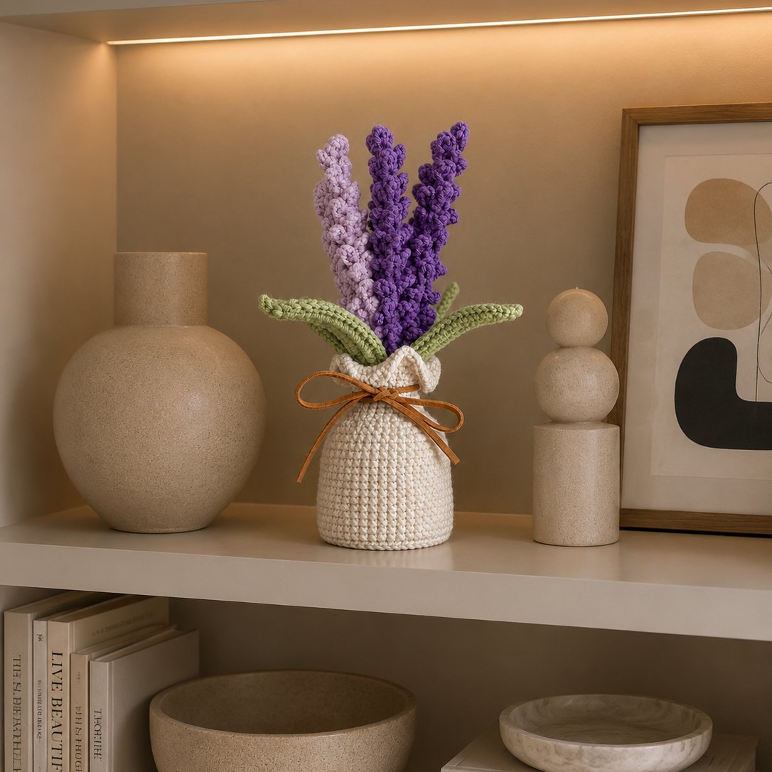 Handmade crocheted lavender plant in cream pot with green leaves on shelf display