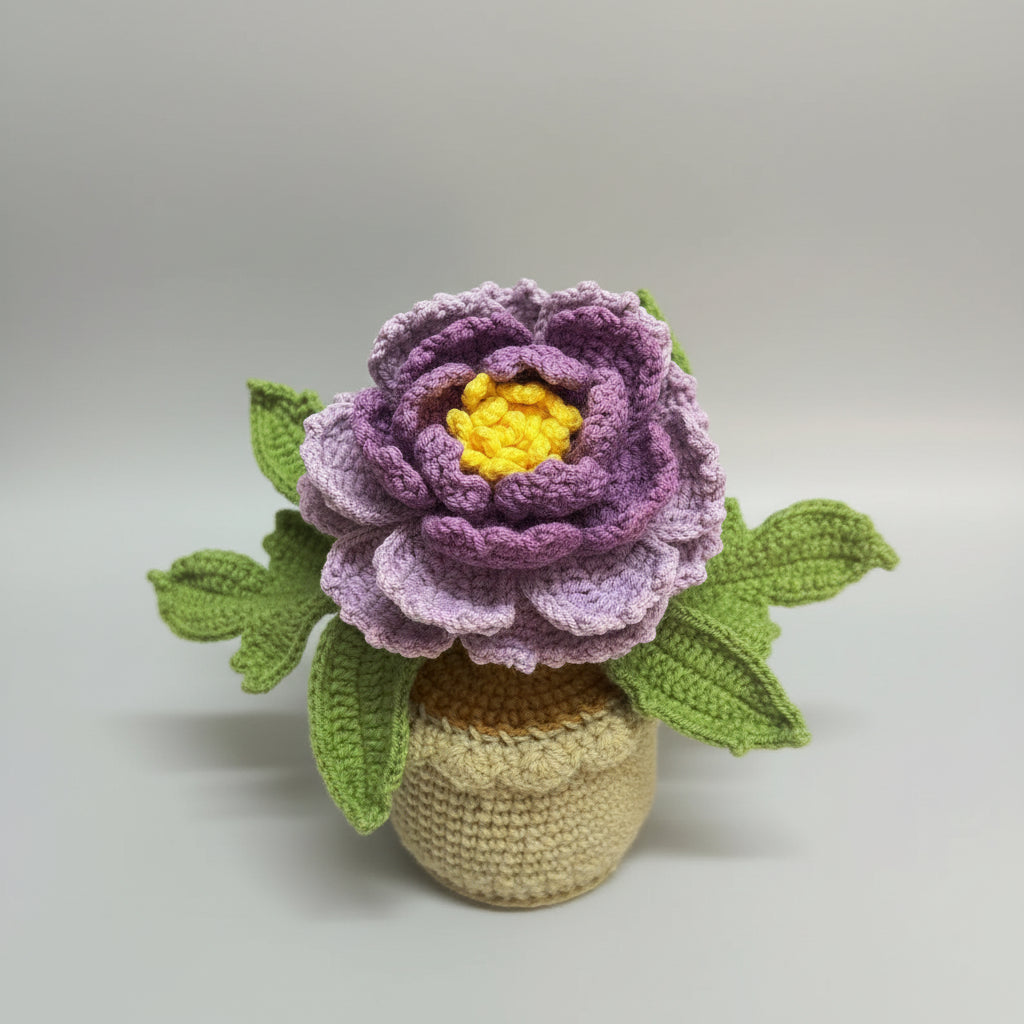 Handmade crochet peony in beige pot with front-facing purple flower and yellow center