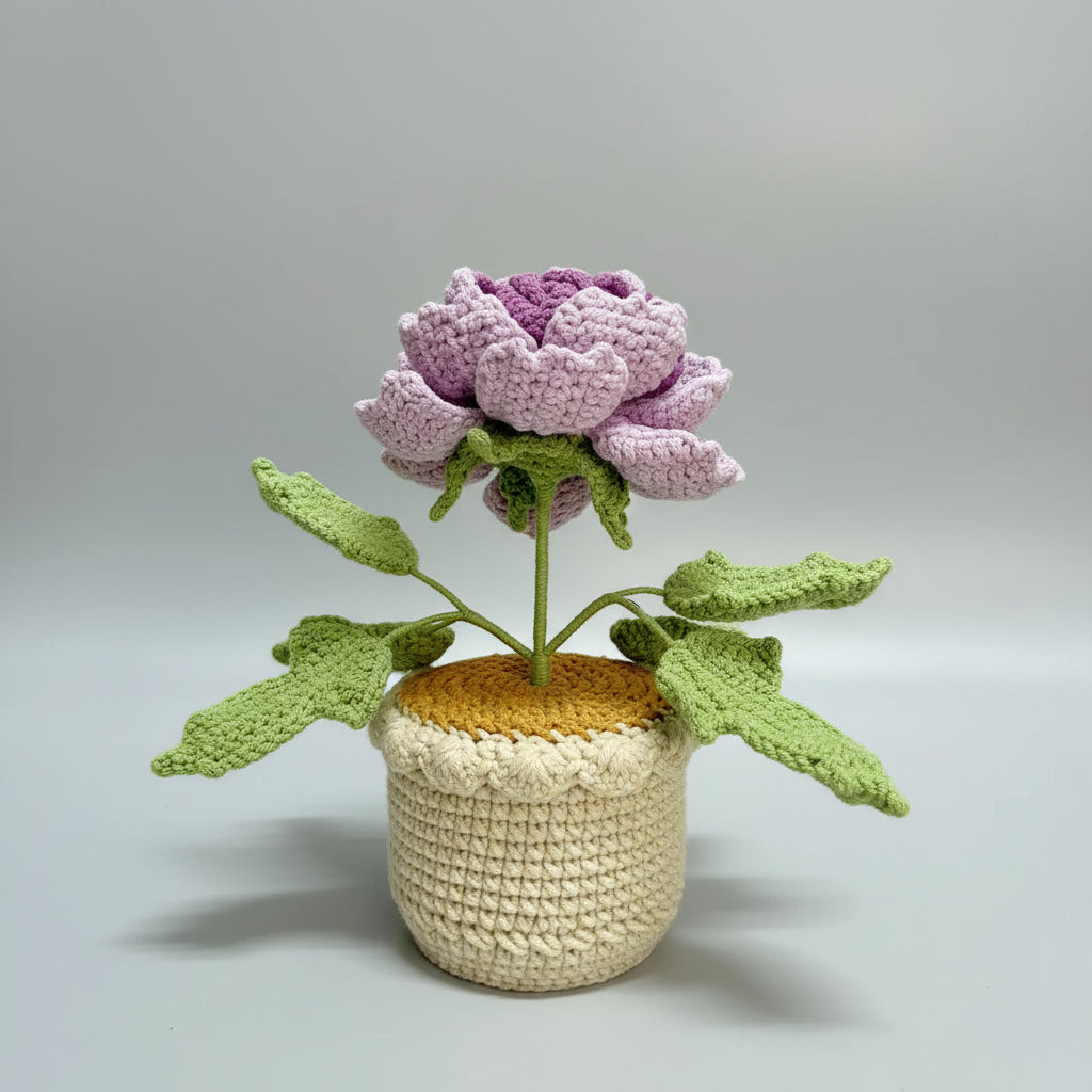 Handmade crochet peony in beige pot, light pink petals and purple bud with green leaves