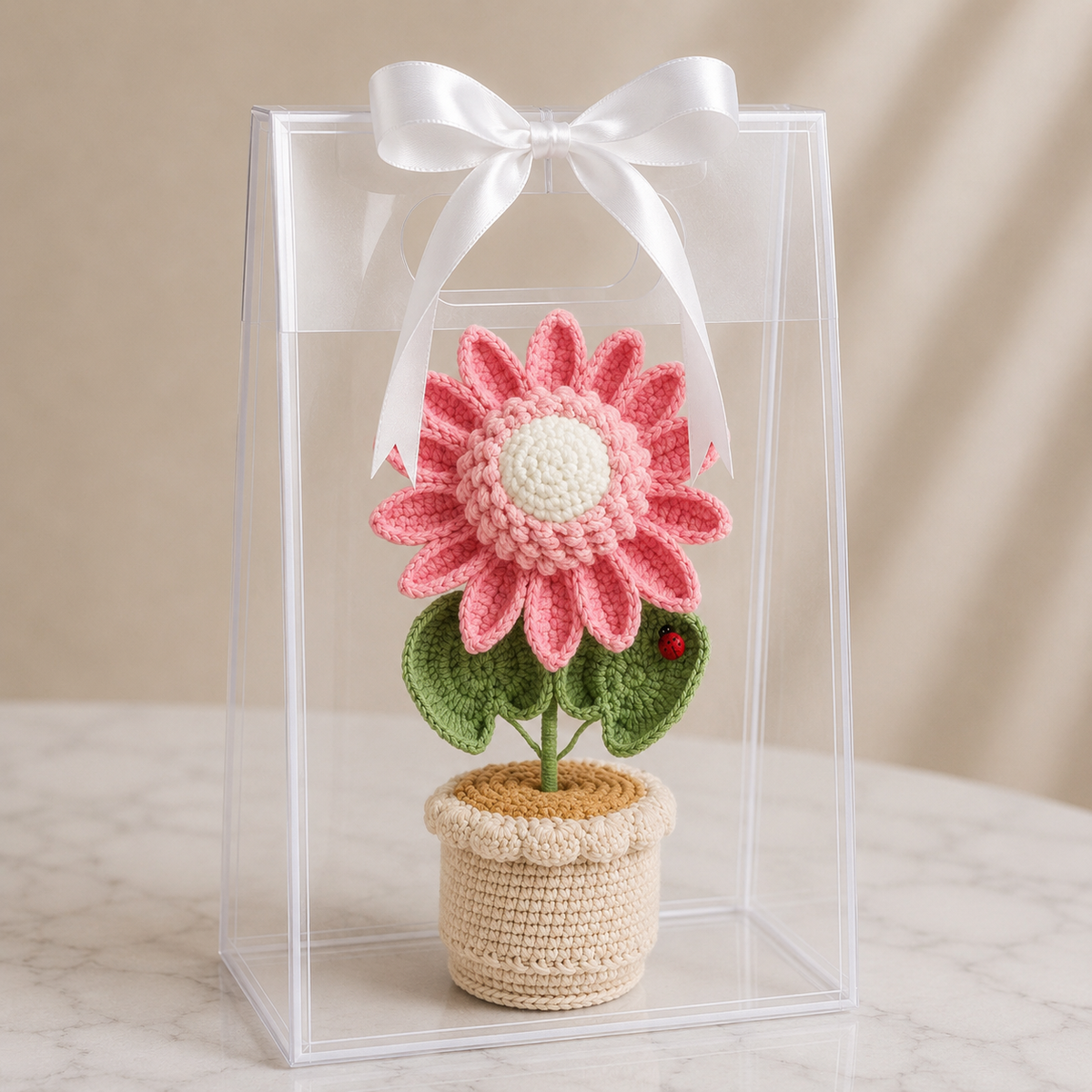 Handmade crochet sunflower in pot with clear gift box and white ribbon bow